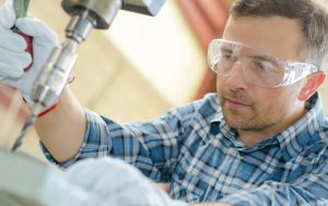 Individual drilling using safety goggles as PPE