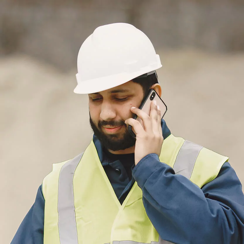 Man on the phone controlling lifting operations